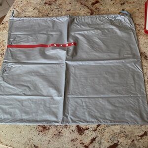 Prada Silver Dust Bag with Red Accent